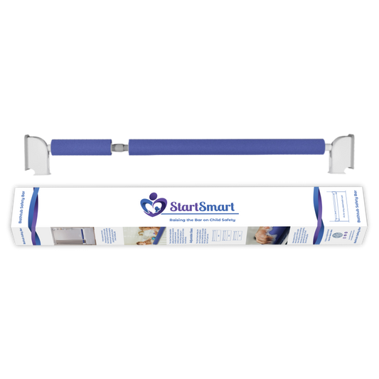 The image shows a Start Smart Safety Bar for bathtubs, featuring blue padding with white grips. This is a close up of the bar above the retail packaging. 